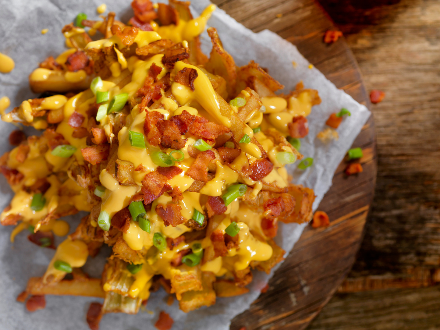 Loaded Blooming Onion with Fries, Cheese Sauce and Bacon